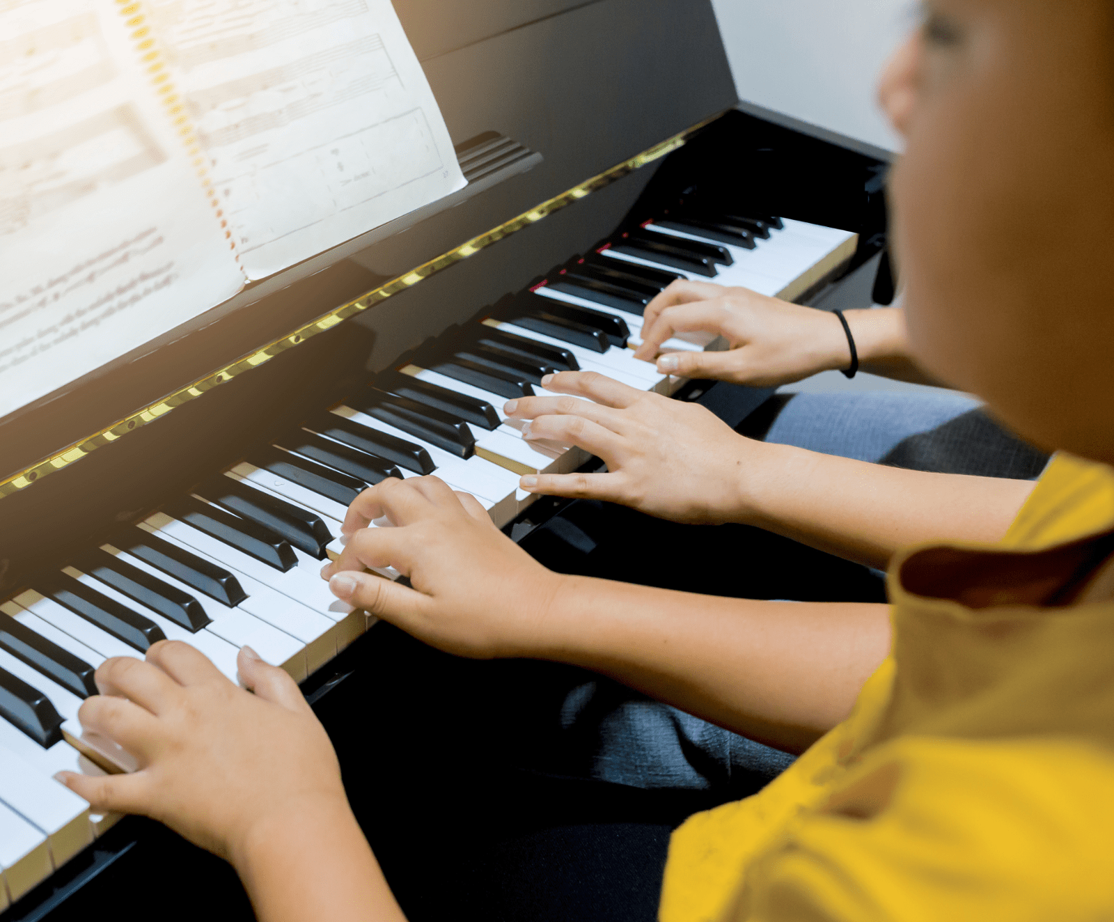Kids playing piano in piano lessons at Serenata Music Studio in Chester, NJ